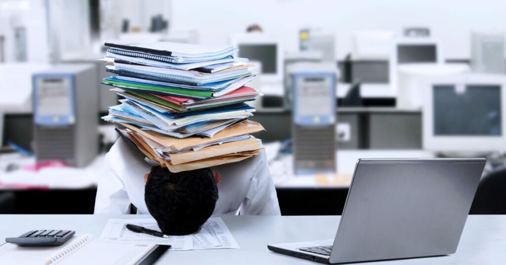 Businessman with documents on his head